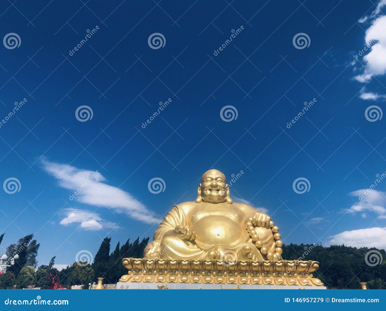 smiling buddha maitreyaÃ¯Â¼Åunder the blue sky and white cloudsÃ¯Â¼Å